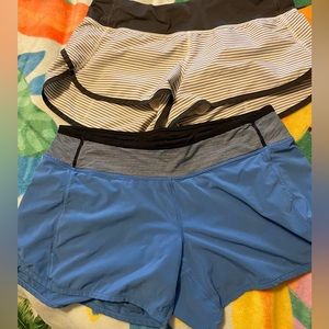 2 pairs lululemon shorts both Sz 8 stripes blue with striped band
